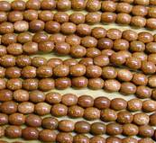 BROWN GOLD STONE RICE BEADS ON A STRING. SPR6031