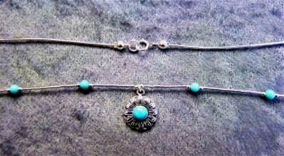 925 SILVER NECKLACE WITH FLOWER DESIGN PENDANT. 976NT