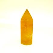 GEMSTONE POLISHED AND FACETED POINT IN DARK HONEY CALCITE.   SP13894POL