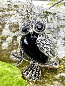 Owl pendant set with a Gemstone Body of  Tigers Eye  inset with faceted eyes.   owl 6