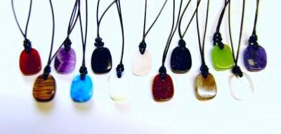 SET OF TEN AJUSTABLE POLISHED FLAT PEBBLE NECKLACES IN VARIOUS GEMSTONES.   SPR14112WH