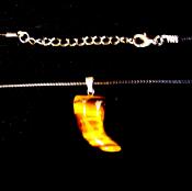 TUSK/ HORN SHAPED PENDANT IN TIGERSEYE ON WAXED CORD.   SPR14697PEND