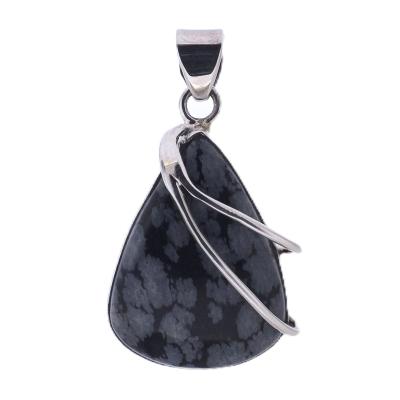 This one off pendant showcases a polished teardrop shape cabochon in snowflake obsidian.   SP9224PEND