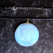 MAN IN THE MOON CARVED PENDANT IN OPALITE ON WAXED CORD.   SPR13955PEND