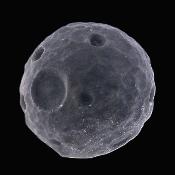 Carving Of A Dwarf Moon Or Planetoid In Silver Sheen Obsidian.   SP17112